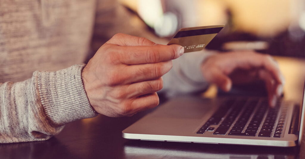 Man making credit card purchase online