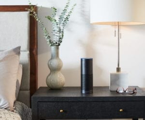 an amazon alexa on the nightstand