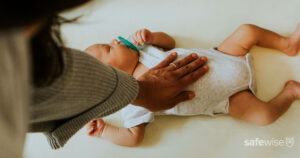 baby-sleeping-on-back-in-crib