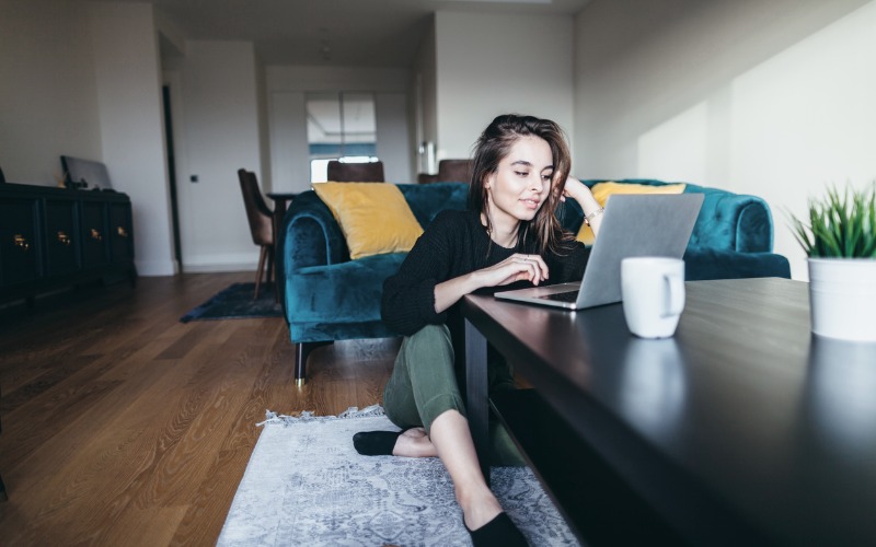 Woman using computer at home