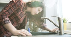 woman looking at sink