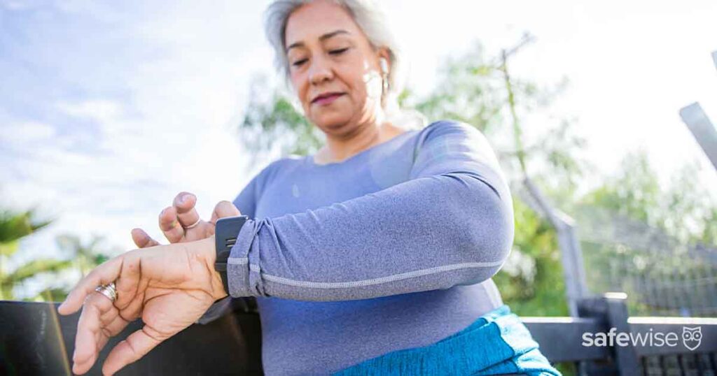 elderly-woman-checking-watch-on-bench