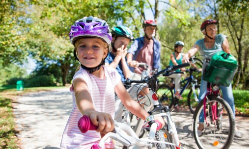 family riding bicycles together