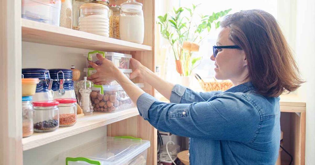 woman organizing bulk storage shelf