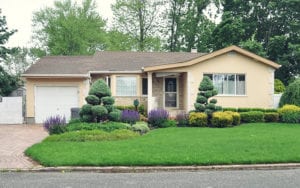 small yellow single family home