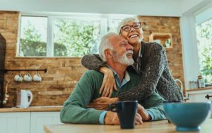 hugging senior couple