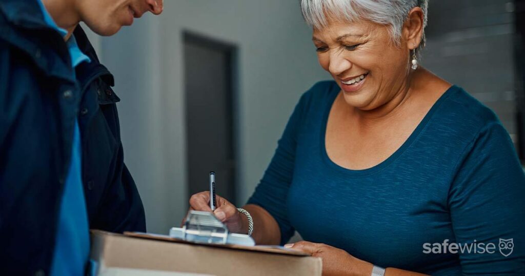 woman signing for a package