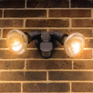 Flood lights on brick wall