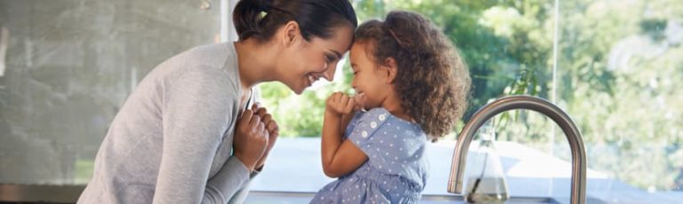 Mother and daughter in kitchen