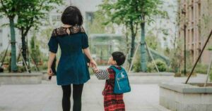 mother walking kid to school