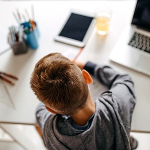 child working at desk