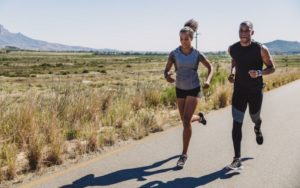 pair of runners running down the road