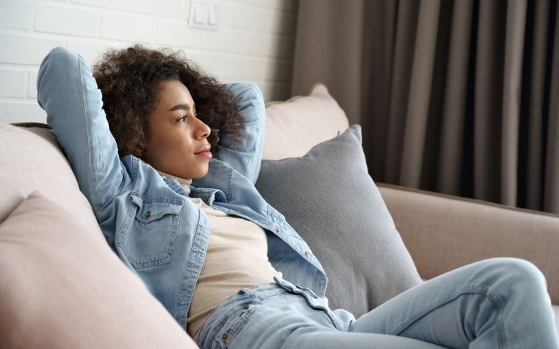 woman sitting on couch