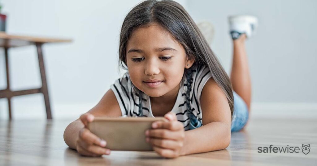 small-kid-using-phone-on-floor