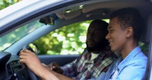 teen driving with parent