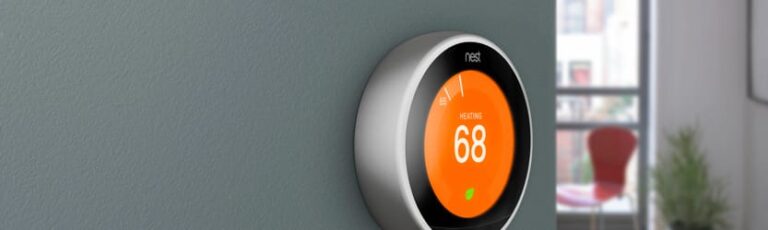 Nest smart thermostat on wall