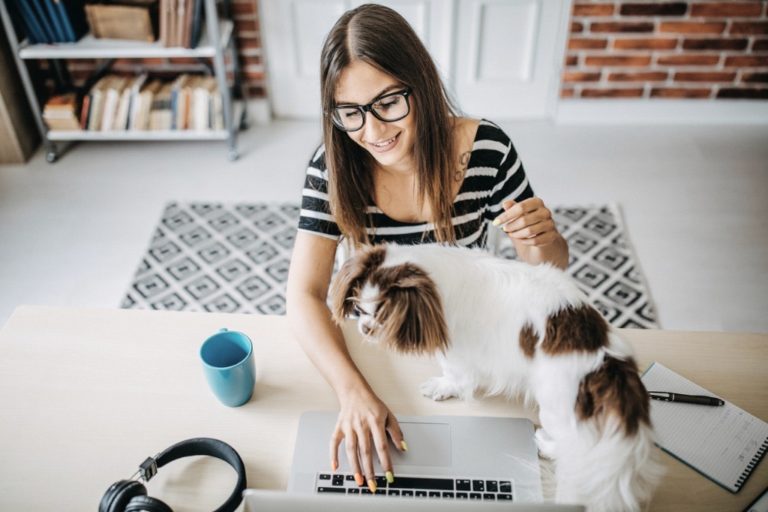 woman working from home with dog