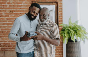 Son giving dad a present