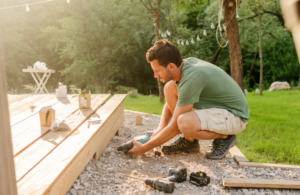 Man improving backyard deck